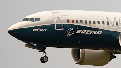 A Boeing 737 Max jet prepares to land at Boeing Field following a test flight in Seattle, Sept. 30, 2020.