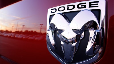 The Dodge logo is seen on a new Dodge RAM 3500 Heavy Duty pickup trucks at sunset at a dealership in Springfield, Ill., Aug. 15, 2010.