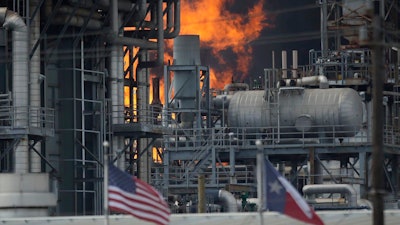 A fire burns at a Shell chemical facility in Deer Park, Friday, May 5, 2023 east of Houston.