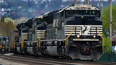 A Norfolk Southern freight train makes it way through Homestead, Pa. on April 27, 2022.