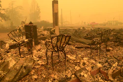 Chairs stand at the Gates Post office in the aftermath of a fire in Gates, Ore., Sept 9, 2020.