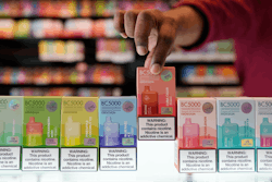 An employee displays some of the varieties of disposable electronic cigarette devices manufactured by EB Design, formerly known as Elf Bar, at Vapes N Smoke in Pinecrest, Fla., Monday, June 26, 2023.