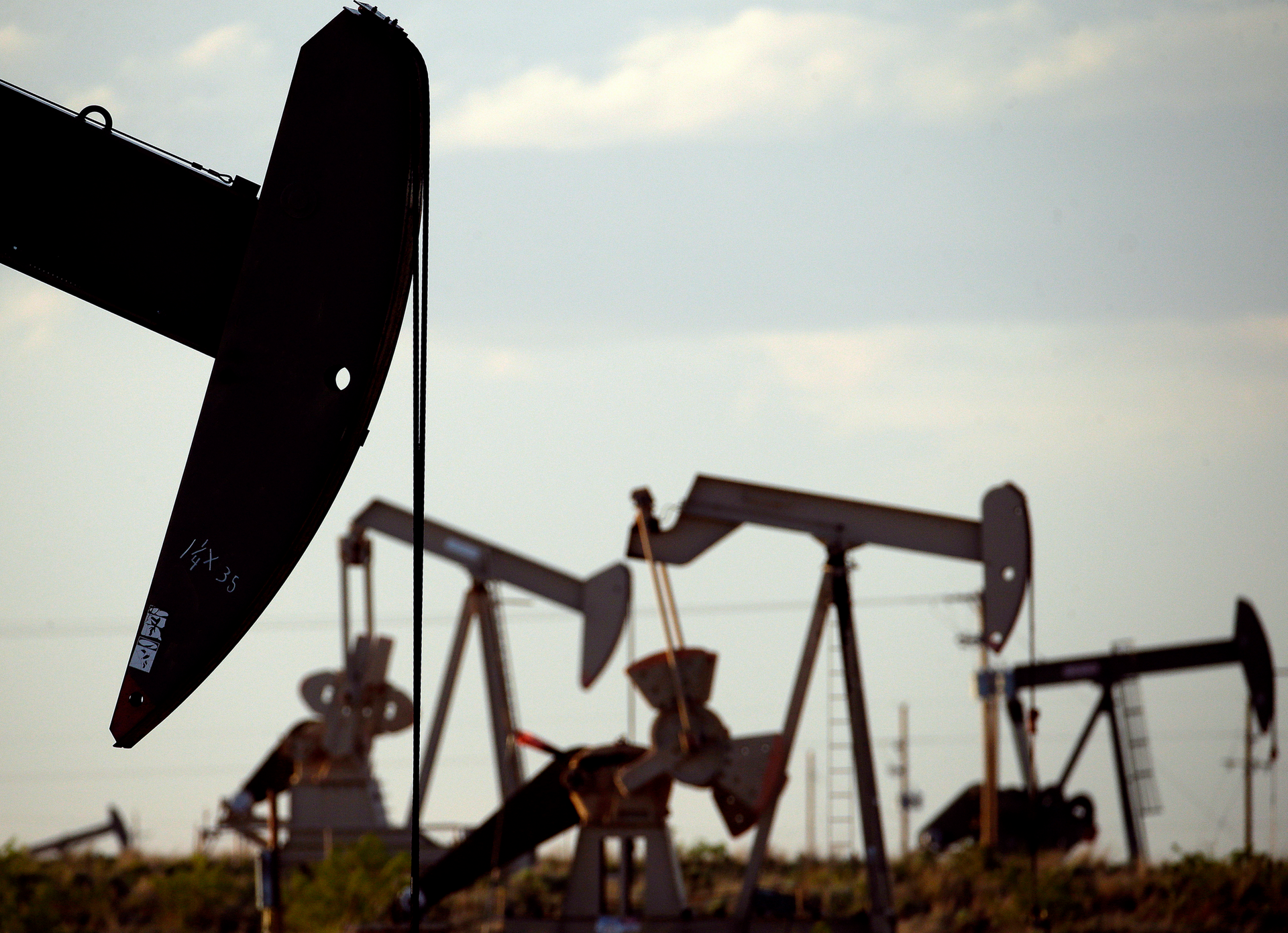 Pump jacks work in a field near Lovington, N.M., April 24, 2015. New Mexico oilfield and air quality regulators on Thursday, June 29, 2023, announced unprecedented state fines against a Texas-based oil and natural gas producer on accusations that the company flouted local pollution reporting and control requirements by burning off vast amounts of natural gas in a prolific energy-production zone in the southeast of the state.