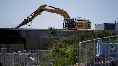 Crews continue to work the scene of a collapsed elevated section of Interstate 95, in Philadelphia, Tuesday, June 13, 2023.