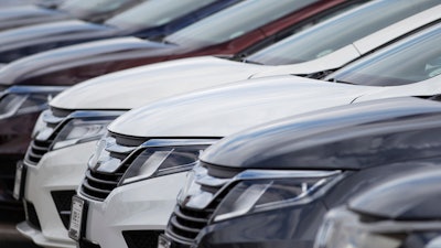 A long row of unsold 2020 Odyssey minivans sits at a Honda dealership in Highlands Ranch, Colo on April 5, 2020. Honda is recalling nearly 1.2 million vehicles in the U.S. because the rear view camera image may not appear on the dashboard screen.
