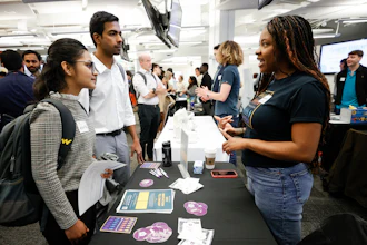 Georgia State University students Kavita Javalagi, left, and Gana Natarajan, second from left, speak with Shetundra Pinkston, during the Startup Student Connection job fair, Wednesday, March 29, 2023, in Atlanta. For the thousands of workers who'd never experienced upheaval in the tech sector, the recent mass layoffs at companies like Google, Microsoft, Amazon and Meta came as a shock. Now they are being courted by long-established employers whose names aren't typically synonymous with tech work, including hotel chains, retailers, investment firms, railroad companies and even the Internal Revenue Service.