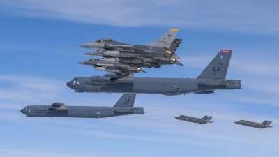 In this photo provided by the South Korean Defense Ministry, U.S. B-52H bombers, center, and F-16 fighter jets and South Korean Air Force F-35A fighter jets, right bottom, fly over the Korean Peninsula during a joint air drill in South Korea on April 14, 2023.