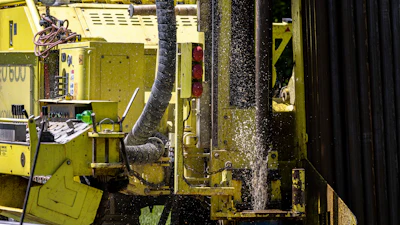 Groundwater squirts up during drilling for a geothermal heating and cooling system at a home in White Plains, N.Y., Monday, May 8, 2023.
