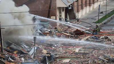 Emergency personnel work at the site of a deadly explosion at a chocolate factory in West Reading, Pa., March 24, 2023.