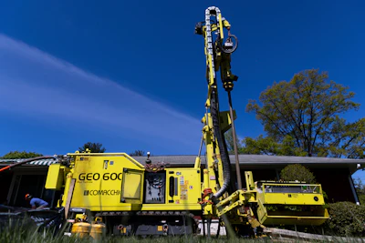 A drill rig sits outside a home during installation of a geothermal heat pump system in White Plains, N.Y., Monday, May 8, 2023.
