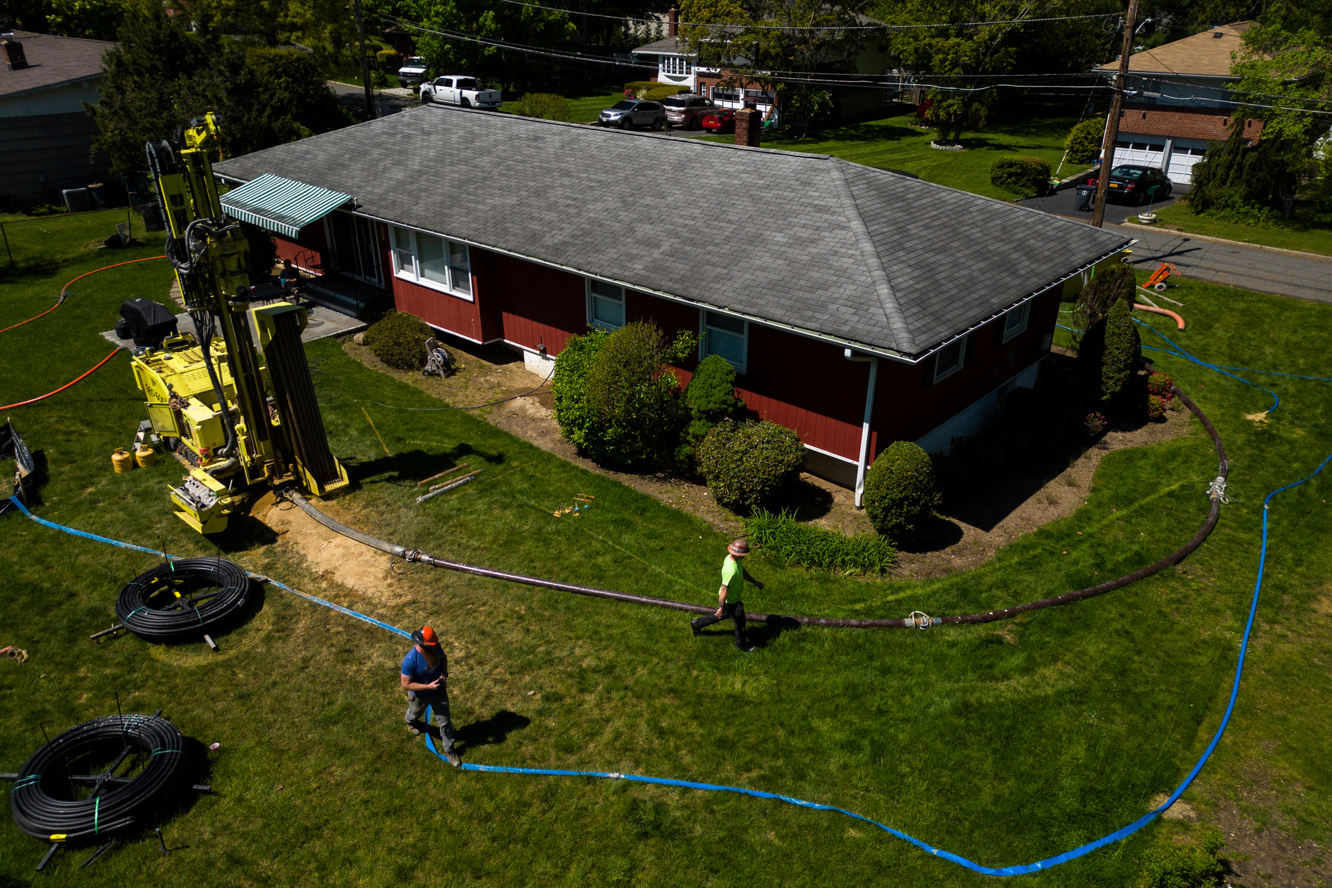 A drill rig for a geothermal heat pump sits outside a home in White Plains, N.Y., Monday, May 8, 2023.