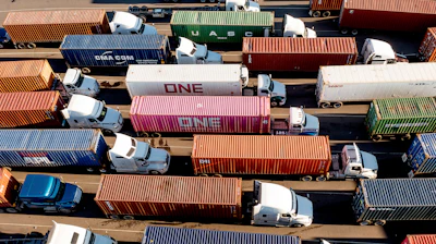 Trucks line up to enter a Port of Oakland shipping terminal on Nov. 10, 2021, in Oakland, Calif.
