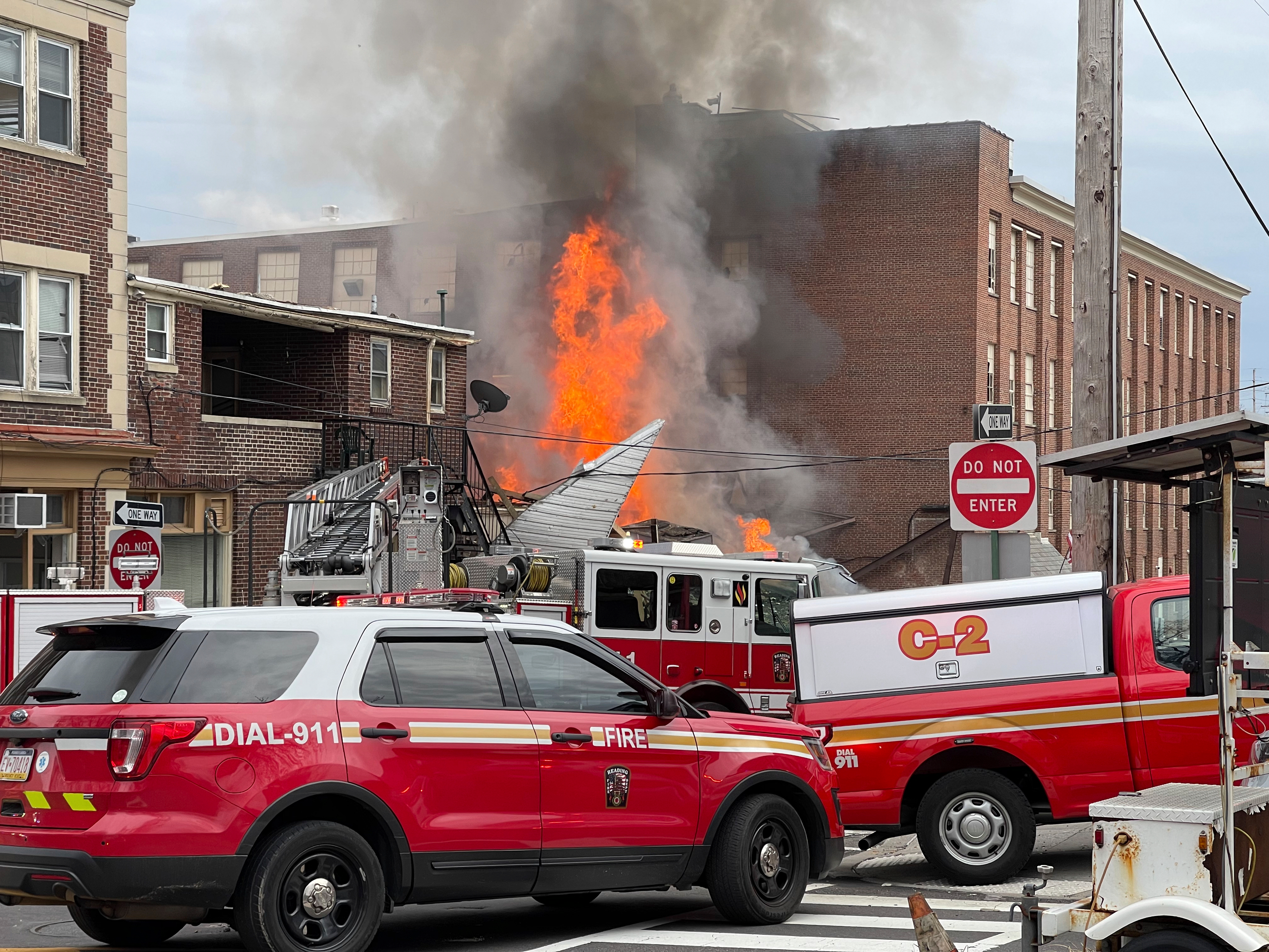 Emergency personnel work at the site of a deadly explosion at a chocolate factory in West Reading, Pa., March 25, 2023.