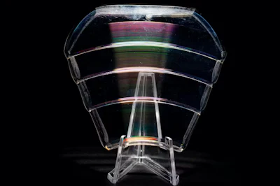 A diffractive lens bends light using etchings and patterns on its surface.