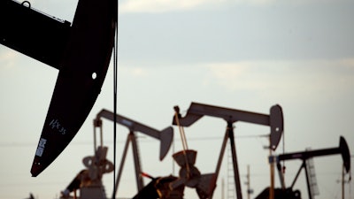 Pump jacks work in a field near Lovington, N.M., April 24, 2015. The Biden administration is proposing new rules for the nation’s oil and gas leasing program that would raise costs for energy companies to drill on public lands and strengthen requirements for cleaning up old wells where drilling is completed or abandoned.