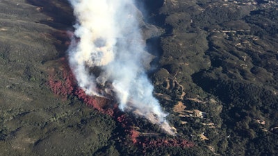This photo provided by Los Padres Forest Aviation and KEYT-TV shows a wildfire burning in Los Padres National Forest, north of Santa Barbara, on Wednesday, June 15, 2016, in Goleta, Calif.