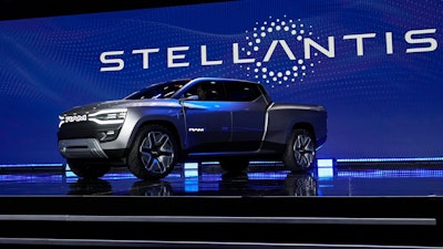 The Ram 1500 Revolution electric battery powered pickup truck is displayed on stage during the Stellantis keynote at the CES tech show on Jan. 5, 2023, in Las Vegas.