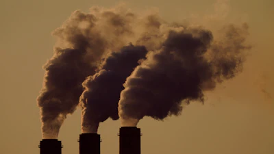 Emissions rise from the smokestacks at the Jeffrey Energy Center coal power plant as the suns sets, near Emmett, Kan., Sept. 18, 2021.