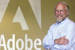Adobe co-founder John Warnock smiles in the lobby at Adobe headquarters in San Jose, Calif., on May 9, 2001.