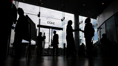 College students arrive for a job fair at Atlanta Tech Village, Wednesday, March 29, 2023, in Atlanta. On Tuesday, the Labor Department reports on job openings and labor turnover for June.