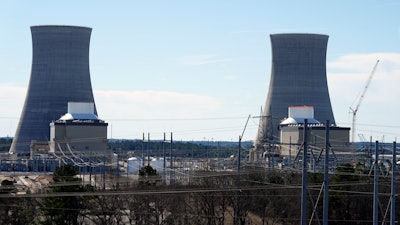 Units 3, left, and 4 and their cooling towers stand at Georgia Power Co.'s Plant Vogtle nuclear power plant, Jan. 20, 2023, in Waynesboro, Ga.