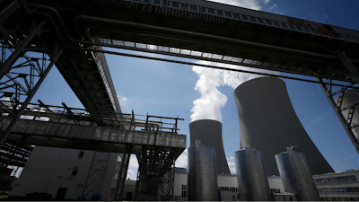 Equipment frames the cooling towers of the Temelin nuclear power plant near the town of Tyn nad Vltavou, Czech Republic, on Thursday, June 25, 2015.