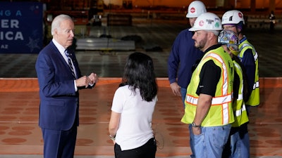 President Joe Biden tours the building site for a new computer chip plant for Taiwan Semiconductor Manufacturing Company, Tuesday, Dec. 6, 2022, in Phoenix.