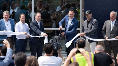 Officials including Tim Watters of Hoffman Equipment, U.S. Rep. John Joyce and Volvo CE Acting President Scott Young cut the ribbon to open the training center.