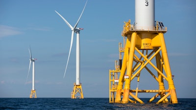 Three wind turbines from Deepwater Wind stand in the water off Block Island, R.I, the nation's first offshore wind farm, Aug. 15, 2016.