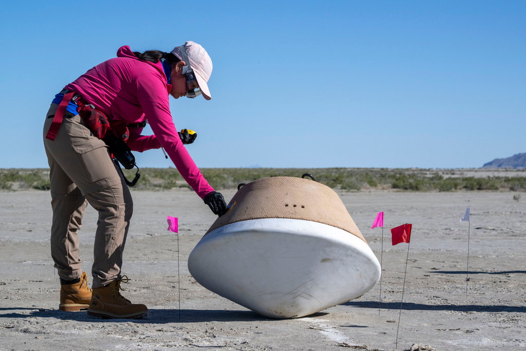 In this photo provided by NASA, recovery teams participate in field rehearsals to prepare for the retrieval of the sample return capsule from NASA's OSIRIS-REx mission at the Department of Defense's Utah Test and Training Range on Aug. 29, 2023.