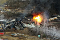This photo taken with a drone shows portions of a Norfolk Southern freight train that derailed the night before in East Palestine, Ohio, still on fire at mid-day on Feb. 4, 2023.