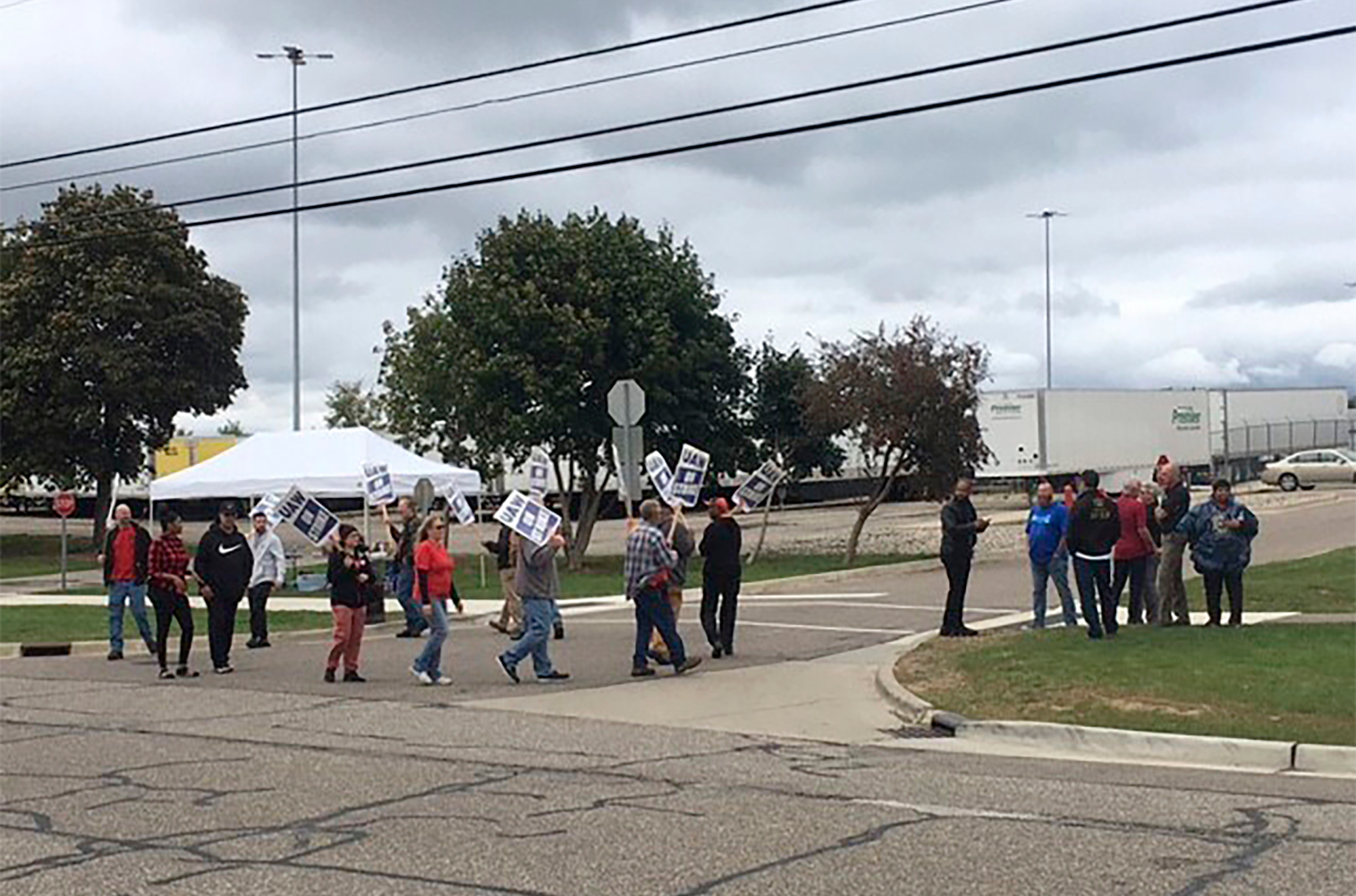 United Auto Workers picket outside the Flint Processing Center where multiple people were hit on Tuesday, Sept. 26, 2023, in Swartz Creek, Mich.