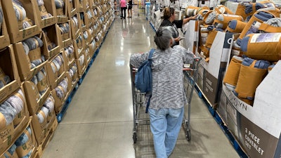 Shoppers look at blankets on sale in a Costco warehouse Thursday, Aug. 24, 2023, in Sheridan, Colo. On Wednesday, the Labor Department issues its consumer prices report for August.
