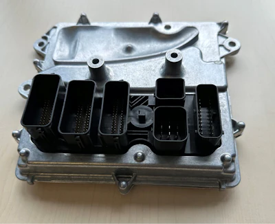 Automotive engine control unit (ECU) with 200 electric-connection pins. This was the first test part in TE-Connectivity’s effort to automate quality inspection.