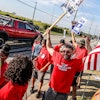 United Auto Workers member Kenneth Carroll, center, of Team 14, dances and cheers on Stickney Avenue outside Stellantis Toledo Assembly Complex on Saturday, Sept. 23, 2023, in Toledo.
