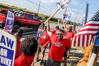 United Auto Workers member Kenneth Carroll, center, of Team 14, dances and cheers on Stickney Avenue outside Stellantis Toledo Assembly Complex on Saturday, Sept. 23, 2023, in Toledo.