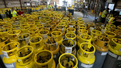 Used refrigerant cylinders sit in a warehouse at the A-Gas Rhome facility on Monday, Oct. 9, 2023, in Rhome, Texas. The company takes in shipments of refrigerators and tanks from around the country and beyond, drains them, then purifies and reclaims the chemicals, shipping out recycled product. This prevents the need for new chemical production.