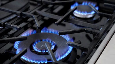 Burners on a natural gas stove in Walpole, Mass., June 21, 2023.