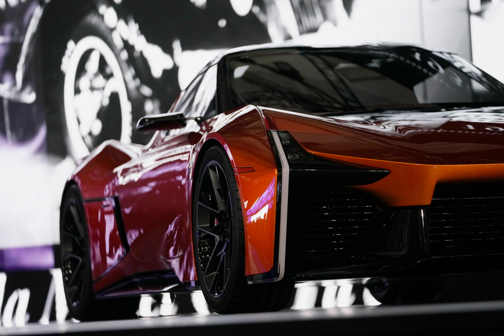 The sporty FT-Se is displayed in a dim light before Toyota Motor Corp. CEO Koji Sato speaks during a briefing on the media day at the Japan Mobility Show in Tokyo, Wednesday, Oct. 25, 2023.