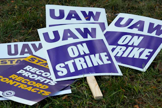 United Auto Workers signs for a strike are shown at the Stellantis Sterling Heights Assembly Plant, in Sterling Heights, Mich., Monday, Oct. 23, 2023.