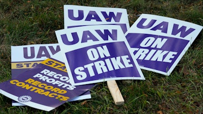 United Auto Workers signs for a strike are shown at the Stellantis Sterling Heights Assembly Plant, in Sterling Heights, Mich., Monday, Oct. 23, 2023.