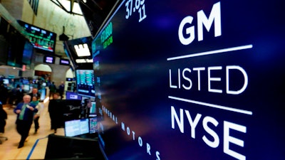 In this April 23, 2018, file photo, the logo for General Motors appears above a trading post on the floor of the New York Stock Exchange.