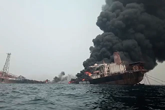 This image from video provided by Bolaji John shows the burning Trinity Spirit anchored 15 miles off the coast of Nigeria, which caught fire on Feb. 2, 2022.