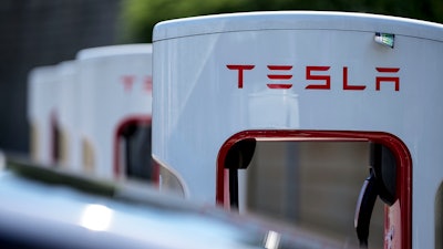 A Tesla charging station is seen, Sept. 28, 2023, in Woodstock, Ga.