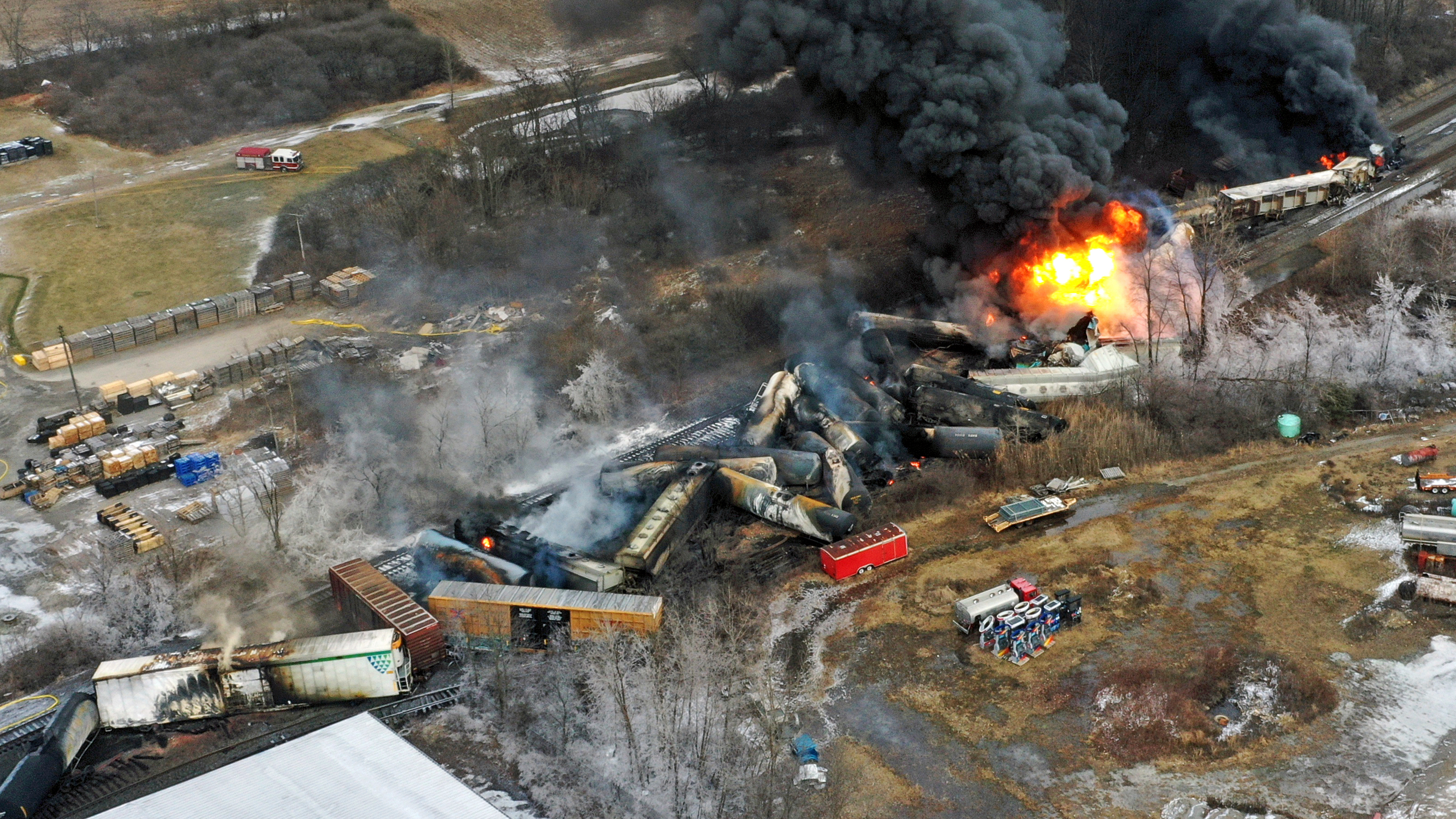 In this photo taken with a drone, portions of a Norfolk Southern freight train that derailed the previous night in East Palestine, Ohio, remain on fire at mid-day, Feb. 4, 2023.