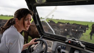 Meredith Ellis does her daily cattle count on her ranch in Rosston, Texas, April 19, 2023.