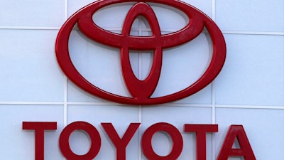 The Toyota logo is seen on a dealership, Aug. 15, 2019, in Manchester, N.H. Toyota said Wednesday, Nov. 1, 2023, that it is recalling nearly 1.9 million RAV4 small SUVs in the U.S. to fix a problem with batteries that can move during forceful turns and potentially cause a fire.