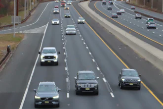 Cars drive on the Garden State Parkway in Brick, N.J. on Tuesday, Nov. 21, 2023, the same day that New Jersey officials said they will move to end the sale of new gasoline-powered vehicles in the state by 2035.