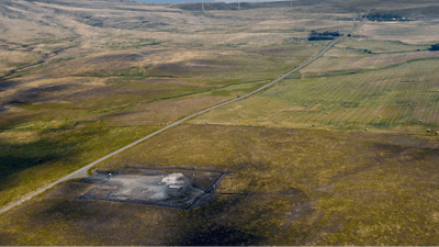 In this image provided by the U.S. Air Force, wind turbines spin near the Malmstrom Air Force Base missile launch site Alpha-03 in Geyser, Mont., in August 2023.