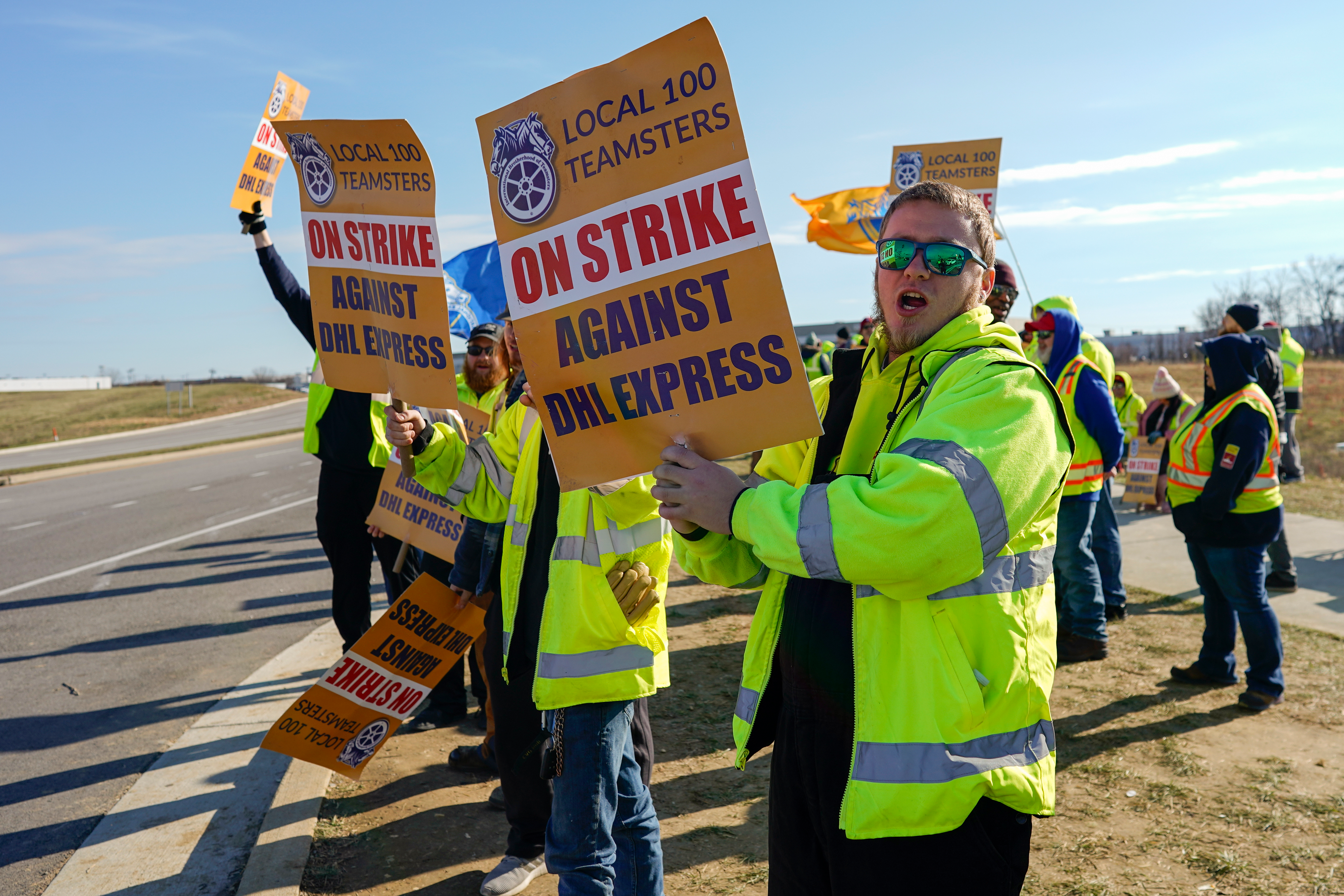 Teamsters protest near the DHL Express Hub at Cincinnati/Northern Kentucky International Airport, Erlanger Ky., Dec. 8, 2023.